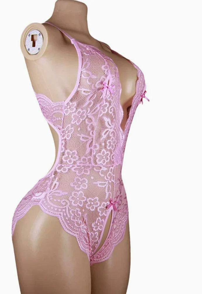Pink lace floral teddy lingerie bodysuit with ribbon accents on mannequin