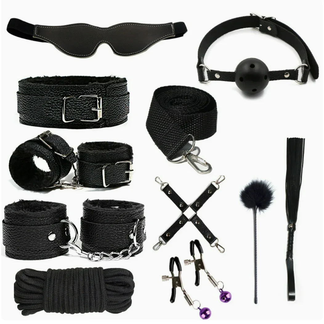 Couples game kit with black blindfold, cuffs, ball gag, leash, rope, and playful accessories.